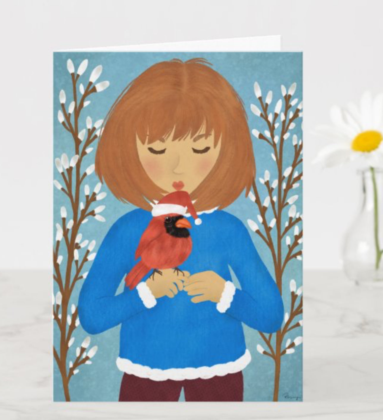 Illustration of a girl holding a cardinal bird against a winter background with bare trees.