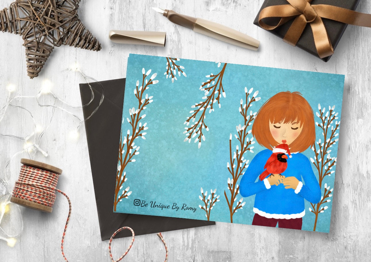 Greeting card with illustration of a person holding a cardinal bird on a winter background, surrounded by decorative items.