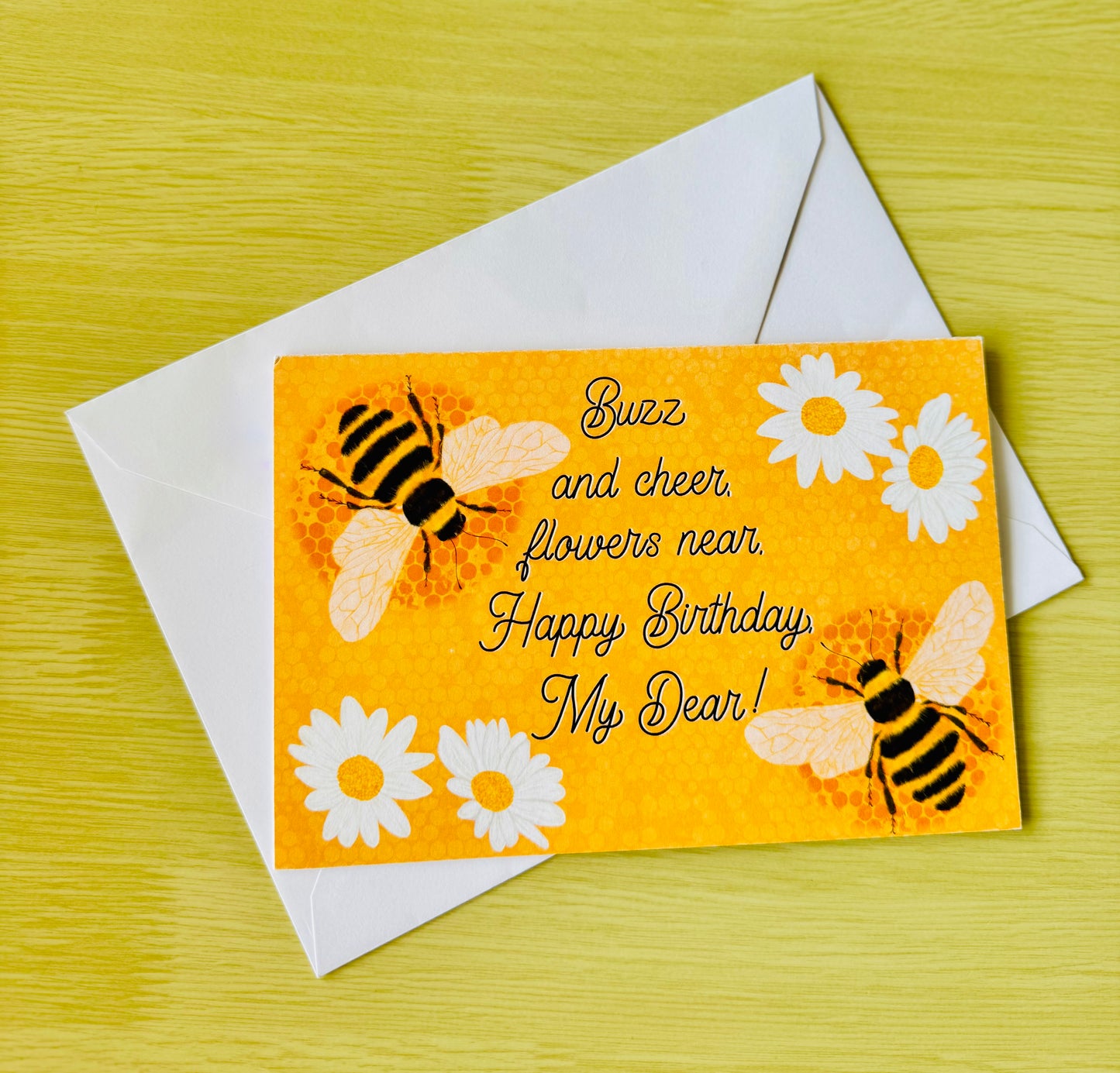 Birthday card with bees and flowers on a yellow background
