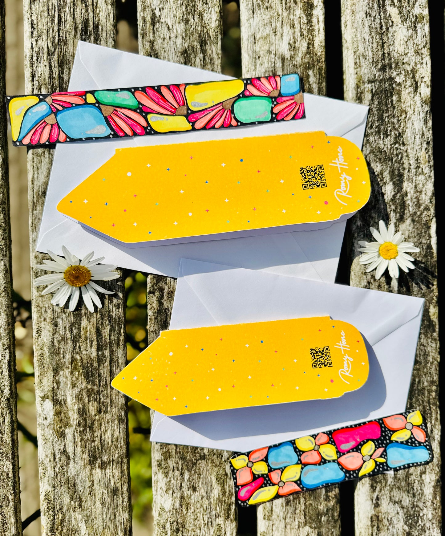 Back Side of the pencils shaped cards with white envelope and flowers 