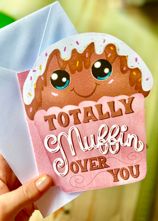 muffin shape card holding in hand 